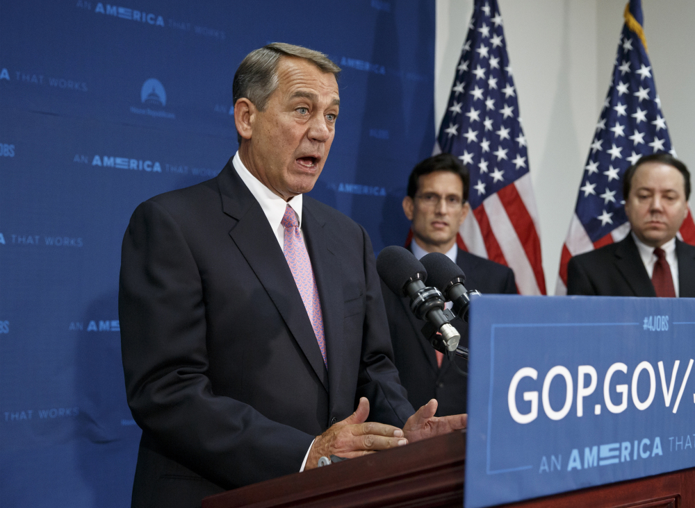 House Speaker John Boehner of Ohio, joined by House Majority Leader Eric Cantor, R-Va., talks to reporters on Capitol Hill in Washington on Tuesday. The Associated Press 