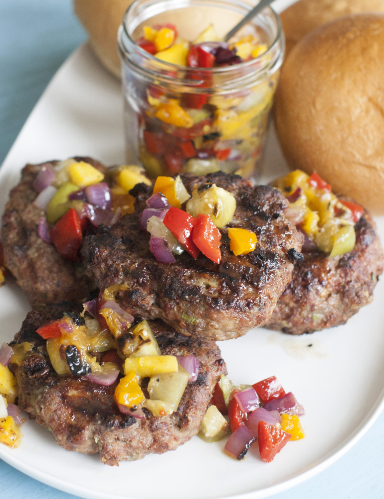 Blue cheese meatloaf burgers with a salsa made of grilled fruit and vegetables are moist and flavorful. The Associated Press 