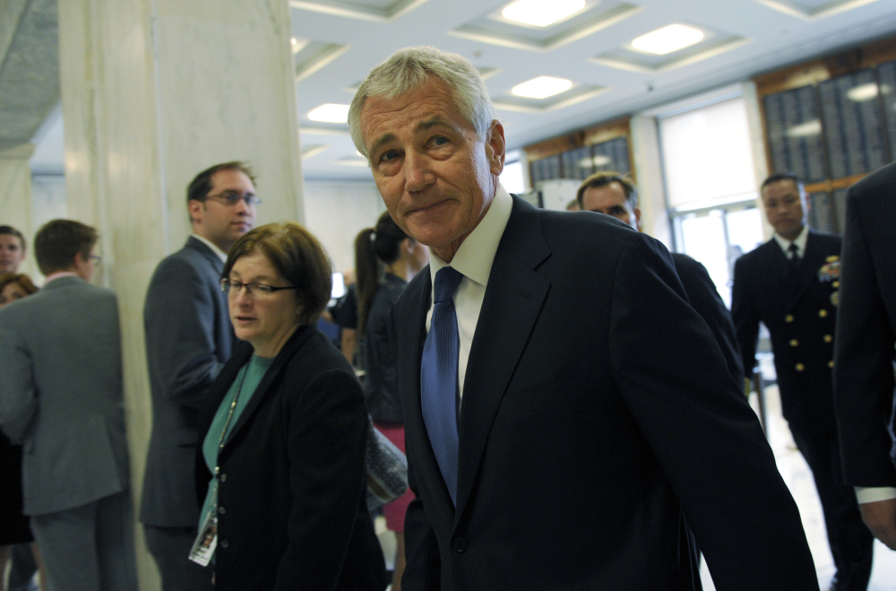 Defense Secretary Chuck Hagel arrives on Capitol Hill in Washington, Wednesday, to testify before the House Armed Services Committee. The Associated Press