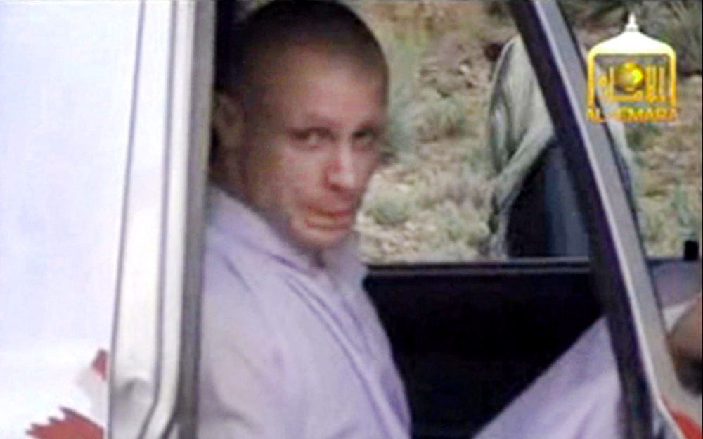 In this image taken from video obtained from Voice Of Jihad Website, which has been authenticated based on its contents and other AP reporting, Sgt. Bowe Bergdahl sits in a vehicle guarded by the Taliban in eastern Afghanistan. The Associated Press