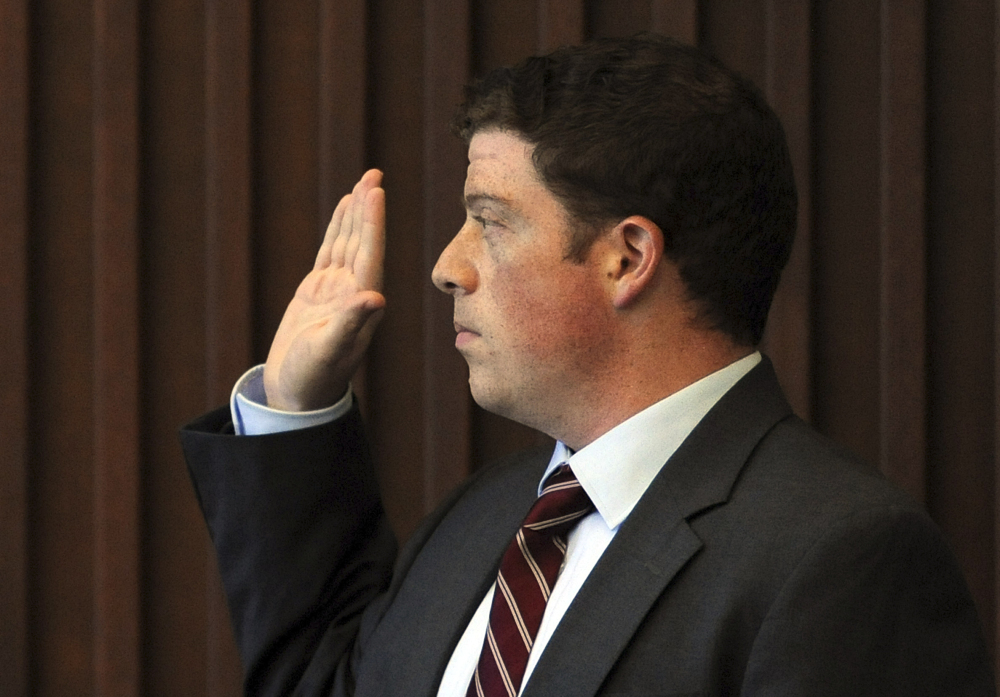 State’s witness Joshua Friedman, a forensic examiner for the FBI, takes the oath before giving testimony about hair and rope fibers at Seth Mazzaglia’s murder trial Wednesday.