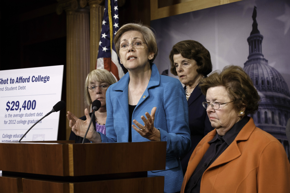 Sen. Elizabeth Warren, D-Mass., center, joined by other women of the Senate, holds a news conference on her bill, the Bank on Students Emergency Loan Refinancing Act, in this June 4, 2014, photo.