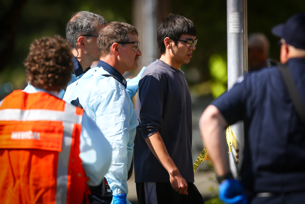 Jon Meis is taken from the scene by medics after he pepper sprayed and tackled a shooting suspect at Seattle Pacific University in Seattle on June 5.