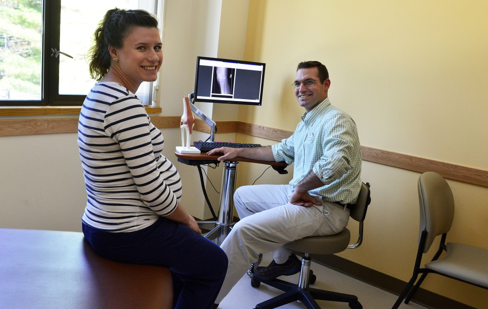 Dr. Brad Wagner, right, and Natalia Provencher are shown at the Intermed Family Medicine clinic in Portland on Friday. Intermed’s addition of roughly 15 jobs during the past five years reflects a trend.