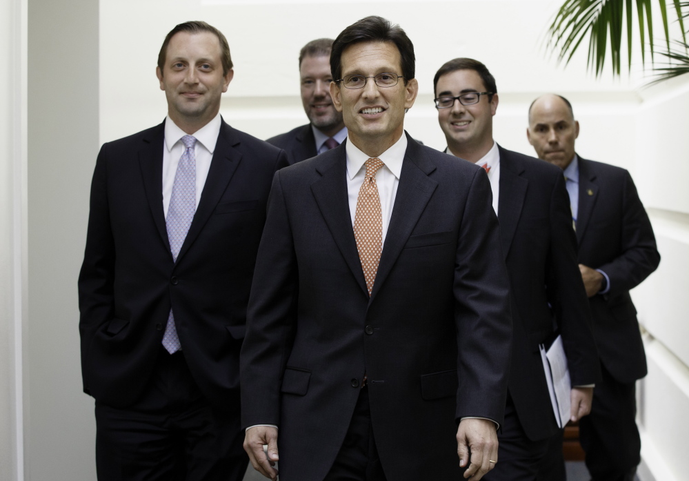 House Majority Leader Eric Cantor arrives on Capitol Hill in Washington on Wednesday,  the day after his defeat in the Virginia primary by tea party challenger David Brat.
