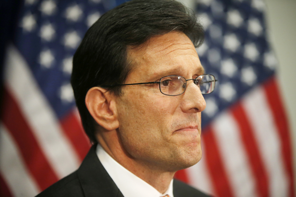 House Majority Leader Eric Cantor of Va. speaks to reporters on Capitol Hill Wednesday. Repudiated at the polls, Cantor intends to resign his leadership post at the end of next month, clearing the way for a potentially disruptive Republican shake-up just before midterm elections with control of Congress at stake.