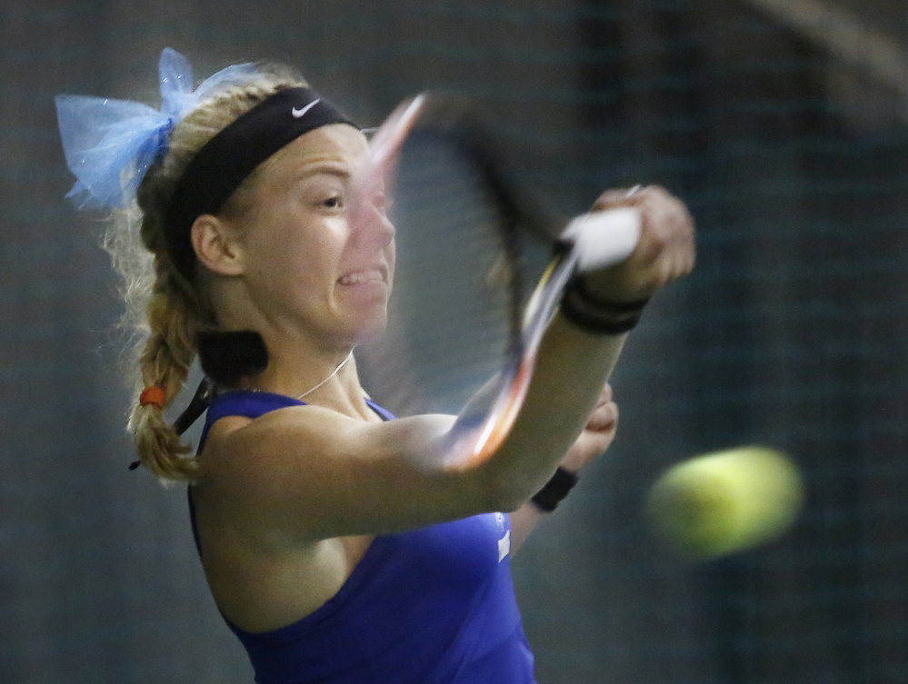 Olivia Leavitt of Falmouth, the state singles champ, returns a shot Thursday during the win over Portland in the Western Class A final. The Yachtsmen, who have won 108 straight matches, meet Brunswick for the state title.