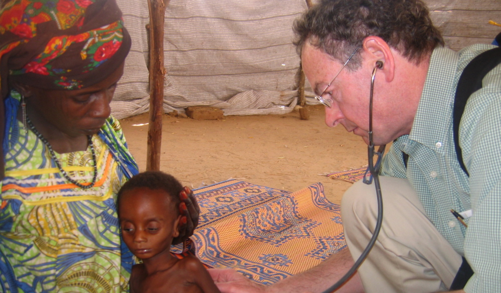 Richard Rockefeller treats a Nigerian child during a meningitis outbreak. Rockefeller died Friday in a plane crash in Westchester County, N.Y., on his way to Portland.