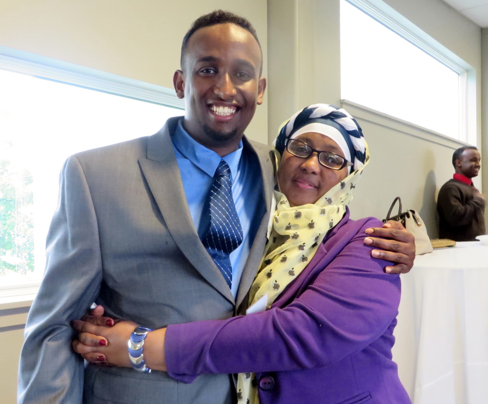 Sharmarke Hussain Ali, honored as the Opportunity Alliance Resident Leader of the Year for creating an after-school program for students with language barriers, with his mother Roda Noor of Portland.