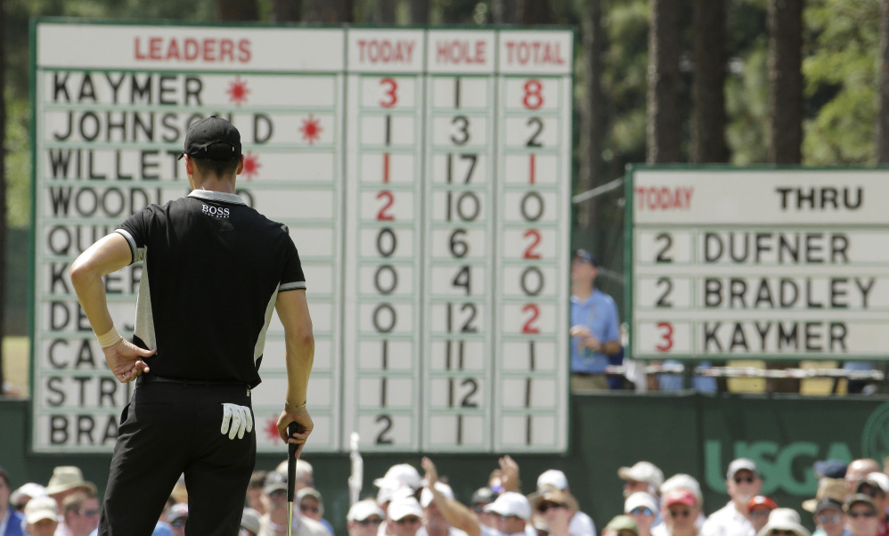 Martin Kaymer, of Germany, looks at his name on top of the leaderboard on the second hole during the second round of the U.S. Open golf tournament in Pinehurst, N.C., Friday, June 13, 2014.