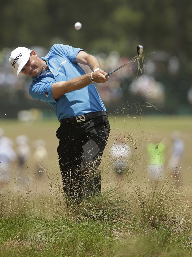 Keegan Bradley hits from the natural area on the eighth hole during the second round of the U.S. Open golf tournament in Pinehurst, N.C., Friday, June 13, 2014.