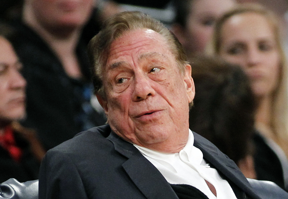 In this December 2011 file photo, Los Angeles Clippers owner Donald Sterling watches the Clippers play the Los Angeles Lakers. Sterling’s team of lawyers has hired four private investigation firms to dig up dirt on the NBA’s former and current commissioners and its 29 other owners, said a person familiar with Sterling’s legal strategy.