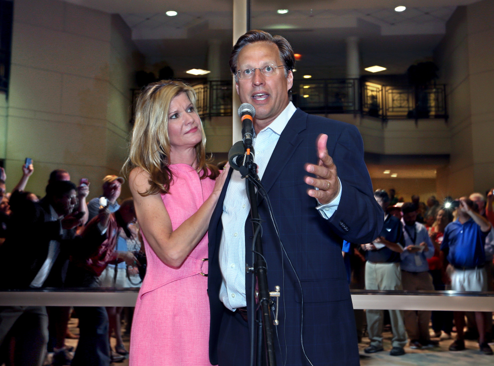 Dave Brat, stands his wife, Laura, as he speaks to supporters after defeating Republican Congressman Eric Cantor in the Republican primary for the 7th Congressional District in Virginia on Tuesday.