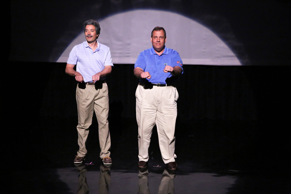This Thursday, June 12, 2014 photo shows host Jimmy Fallon, left, and Gov. Chris Christie during the “Evolution of Dad Dancing” skit on “The Tonight Show Starring Jimmy Fallon.”