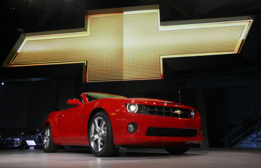 The 2011 Chevrolet Camaro convertible is shown at its debut at the Los Angeles Auto Show in November 2010. General Motors is recalling nearly 512,000 Chevrolet Camaro cars from the 2010 to 2014 model years. A driver’s knee can bump the key and knock the switch out of the “run” position, causing an engine stall.