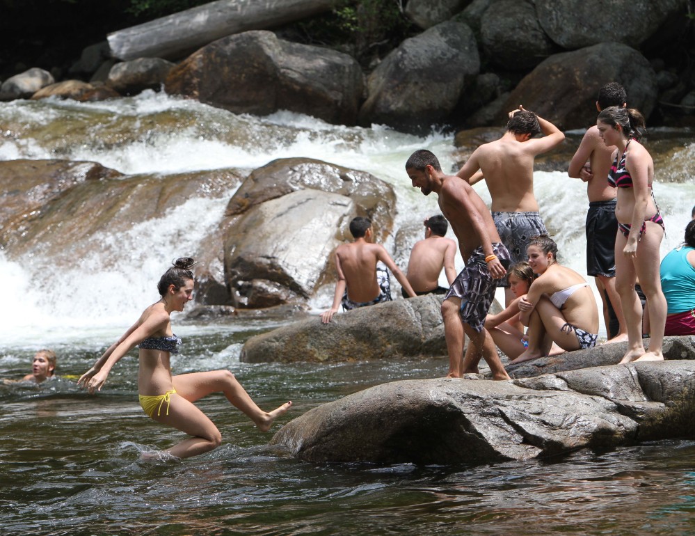 People enjoy the Lower Falls of the Swift River in Albany, N.H., in 2012. The popular spot will be closed for safety and other improvements during the summer and fall of 2014.