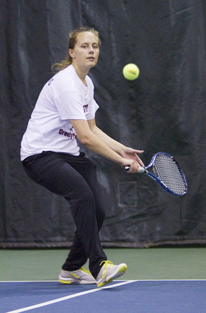 Anna Collins of Greely returns a volley to Emily Dufour of Waterville during their singles match Saturday in the Class B finals. Collins rallied to a three-set victory.