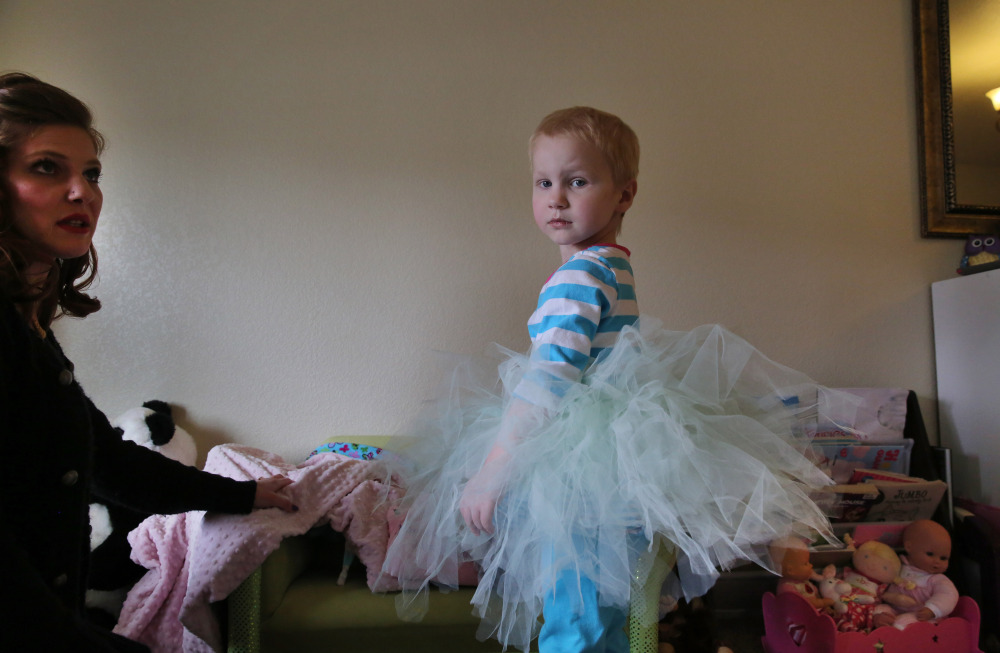 Moriah Barnhart plays with her 3-year-old daughter, Dahlia, who is a cancer patient, at their home in Colorado Springs. Barnhart, frustrated with mainstream medical treatments, moved to Colorado, where adult marijuana use is legal, so Dahlia could receive cannabis-based treatment. But she worries that she could be prosecuted as a child abuser under the state’s current law.