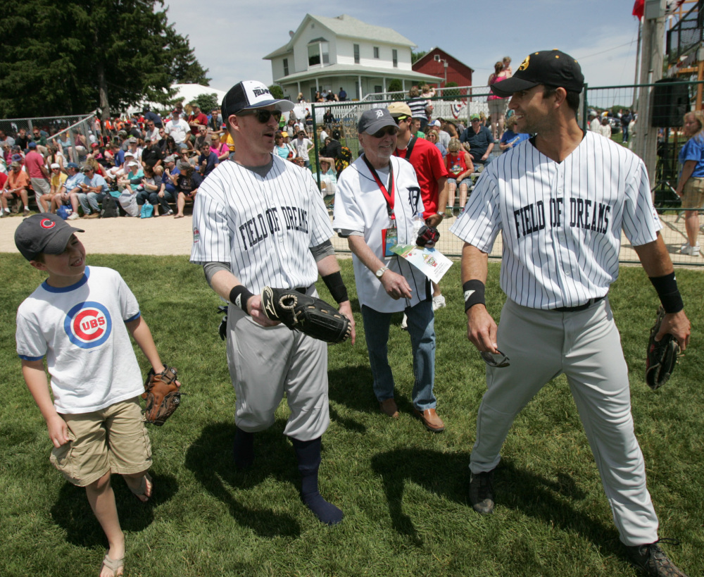 Actor Colin Egglesfield, right; his father Bill; brother Sean and nephew Colton arrive for the celebrity softball game Saturday at the Field of Dreams near Dyersville, Iowa.