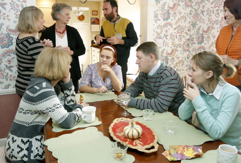 Russian gay-rights activists Lyudmila Romodina, seated middle, and Oleg Klyuenkov, seated right, visit in Cape Elizabeth in 2013 with members of P-FLAG, a group that supports gay and lesbian children.