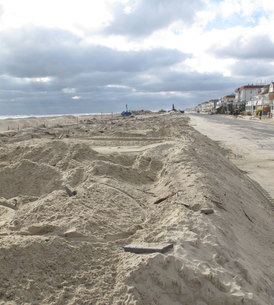 This Nov. 15, 2012 photo shows a pile of sand where the Belmar, N.J., boardwalk had been before Superstorm Sandy. On Monday, the Department of the Interior awarded 11 states $102 million in grants to protect against future storms.