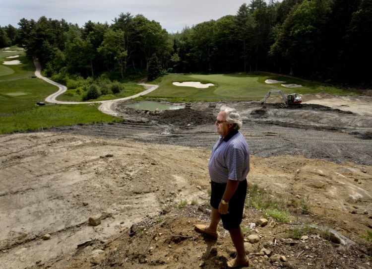 Paul Coulombe, owner of the Boothbay Harbor Country Club, stands on the edge of a construction zone on his golf course Wednesday. Coulombe is using his own funds to completely renovate the property.