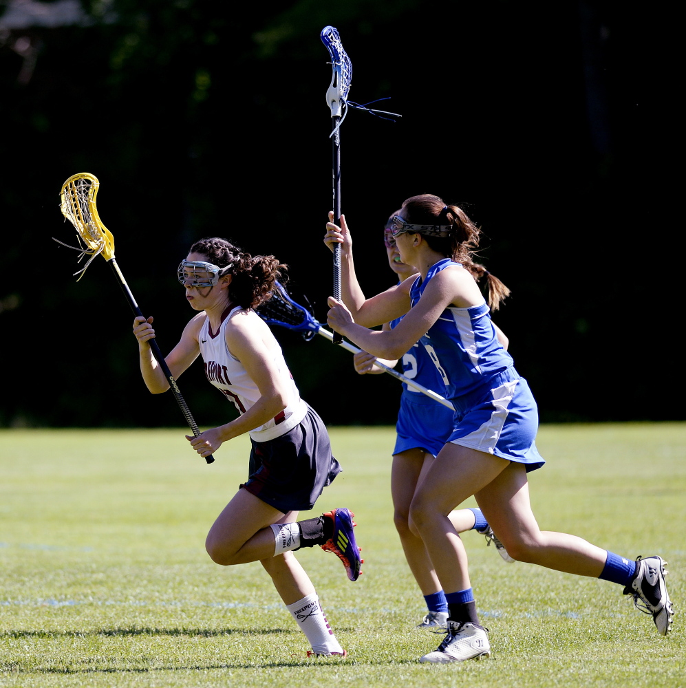 Freeport's Lily Johnston drives down field with the ball in girls lacrosse action against Morse Monday, June 16, 2014. Shawn Patrick Ouellette/Staff Photographer