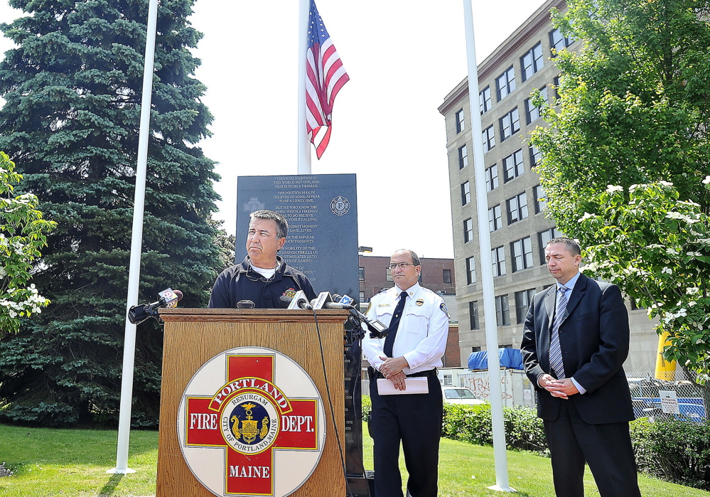 Lt. John Brooks, president of Local 740 of the International Association of Fire Fighters, speaks about the accident that took the life of Capt. Michael Kucsma Tuesday in Portland. To his right are Portland Fire Chief Jerry LaMoria and Police Chief Michael Sauschuck.