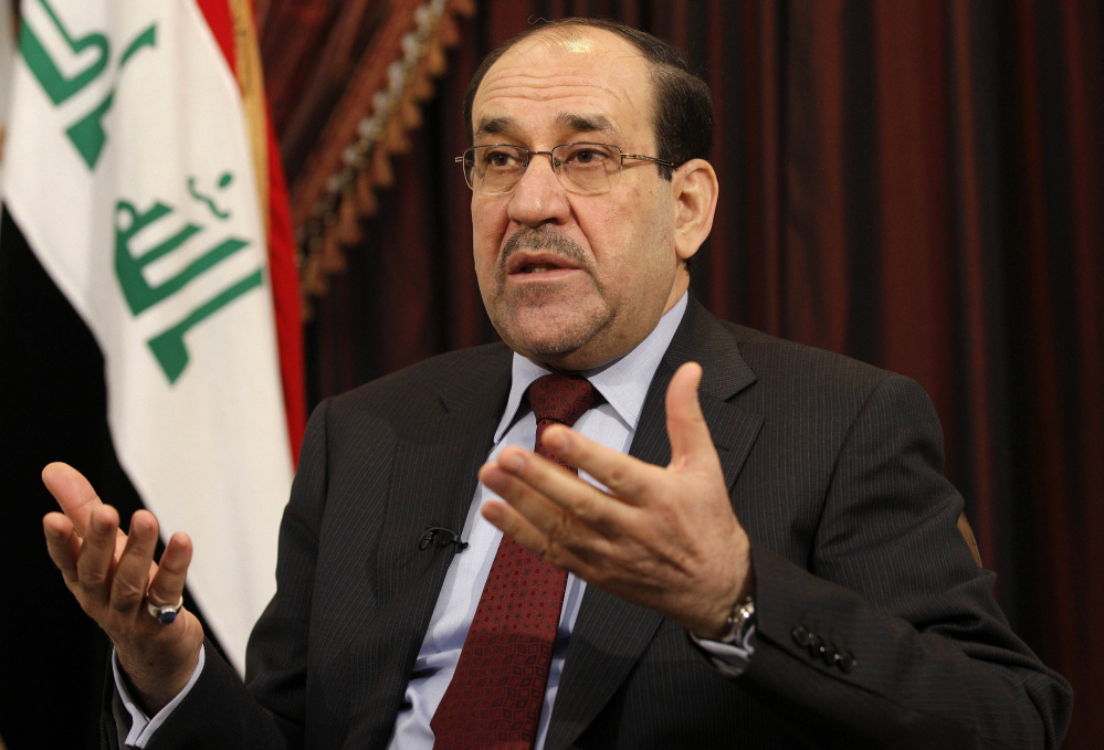 This December 2011 file photo shows Iraq’s Shiite Prime Minister Nouri al-Maliki talks during an interview with The Associated Press in Baghdad, Iraq. Lawmakers who eagerly voted to authorize military force 12 years ago to oust Saddam Hussein and destroy weapons of mass destruction that were never found now harbor doubts that air strikes will turn back insurgents threatening Prime Minister Nouri al-Maliki’s government and Baghdad.