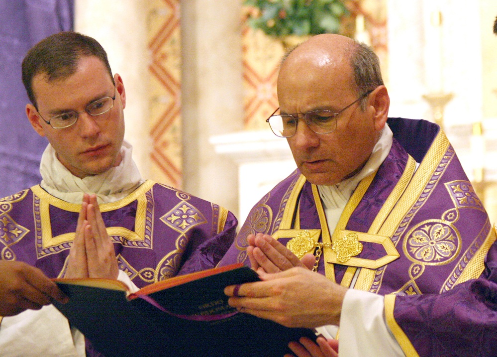 The Associated Press In this undated file photo provided by The Catholic Sun, the Rev. Kenneth Walker, left, and the Rev. Joseph Terra perform a Mass in Phoenix.