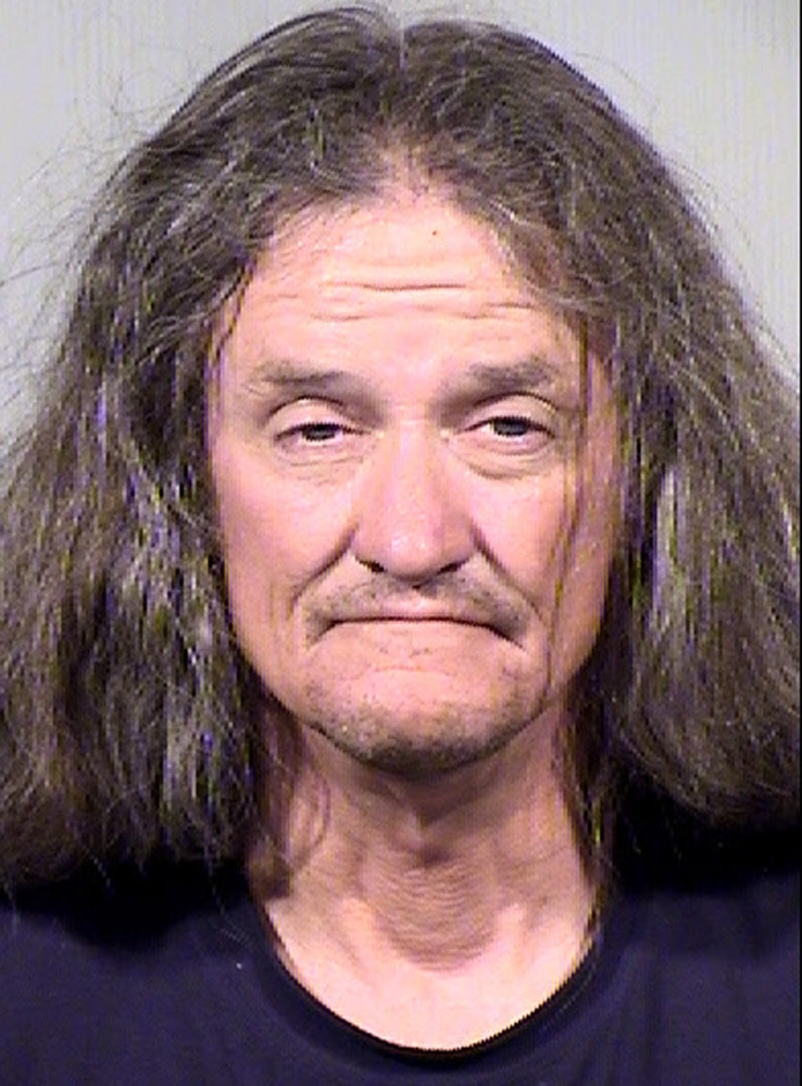 Gary Moran is seen in this June 16, 2014 booking photo provided by the Maricopa County Sheriff’s Office. Moran is being held on $1 million bond on suspicion of first-degree murder, burglary and armed robbery, among others charges in the killing of a Roman Catholic priest and the beating of a second priest at a downtown Phoenix church.