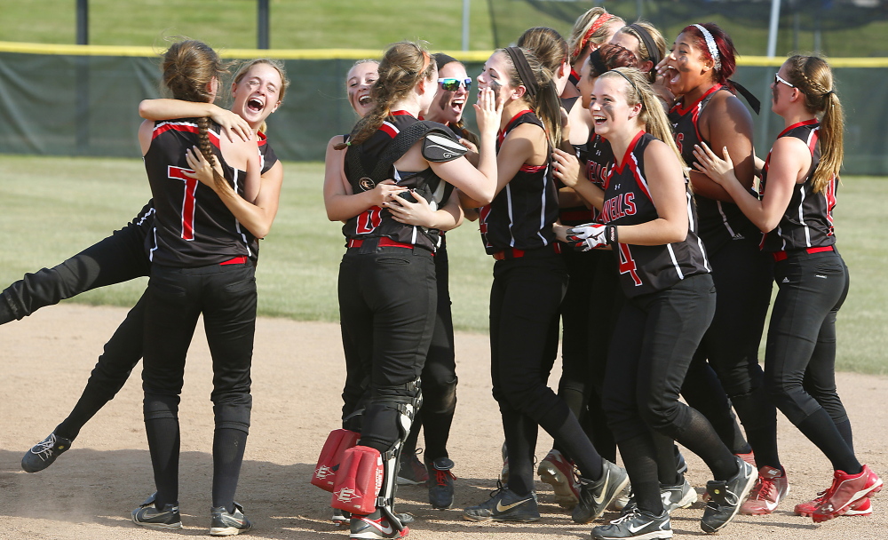 Wells High School players celebrate after defeating Cape Elizabeth High School during their Western Class B championship softball game at Saint Joseph’s College in Standish on Wednesday.