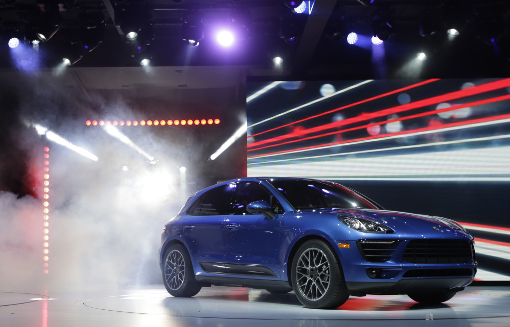 In this November 2013 file photo, the new Porsche Macan S is introduced at the Los Angeles Auto Show.