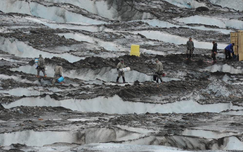 The Joint Task Force-Alaska Team from Joint Base Elmendorf-Richardson and Fort Wainwright recovers debris in 2012 on Colony Glacier near Anchorage, Alaska. The military says the remaining 35 service members have not yet been recovered.