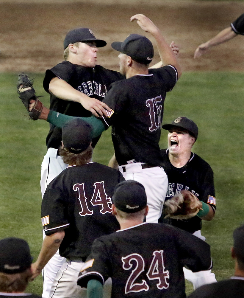 Greely players celebrate after their 4-0 win Wednesday over Lincoln Academy in the Western Class B baseball championship game at St. Joseph’s College.