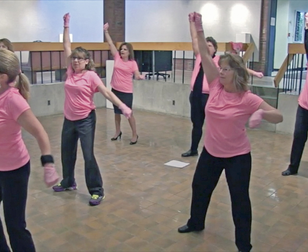 Dancers rehearse at the University of Maine at Augusta for a Pink Glove Dance routine that will be part of a cancer fundraiser video contest.