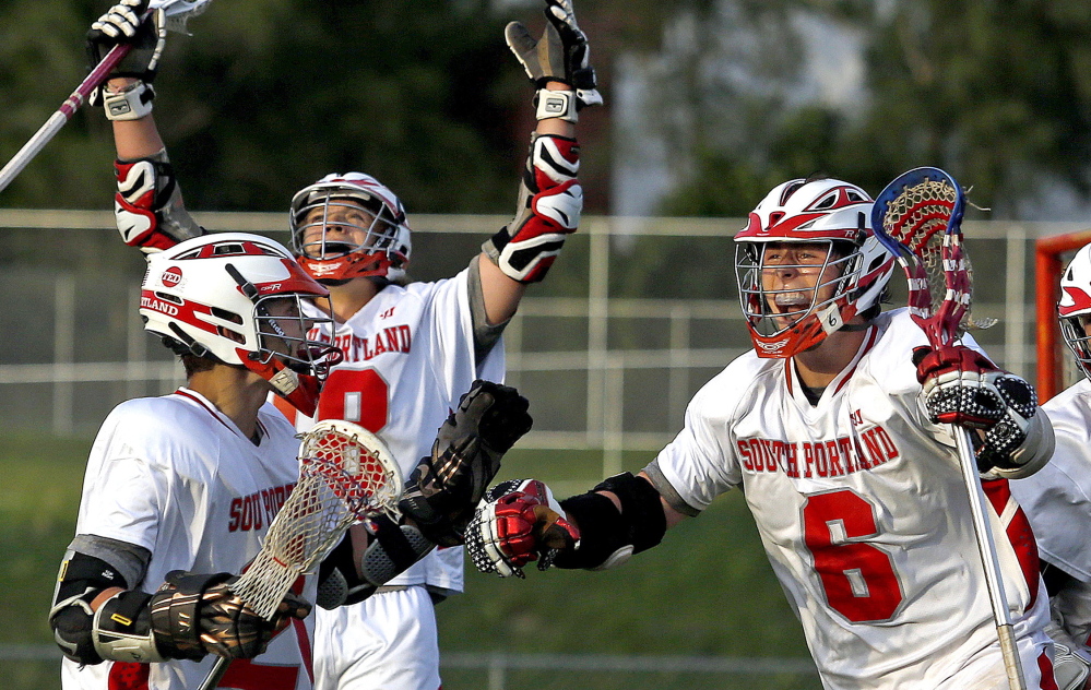 South Portland’s Duncan Preston, 6, celebrates after scoring the winning goal with 1.9 seconds left in Wednesday’s Western Class A boys’ lacrosse final in South Portland. The Red Riots scored three times in the final minute.