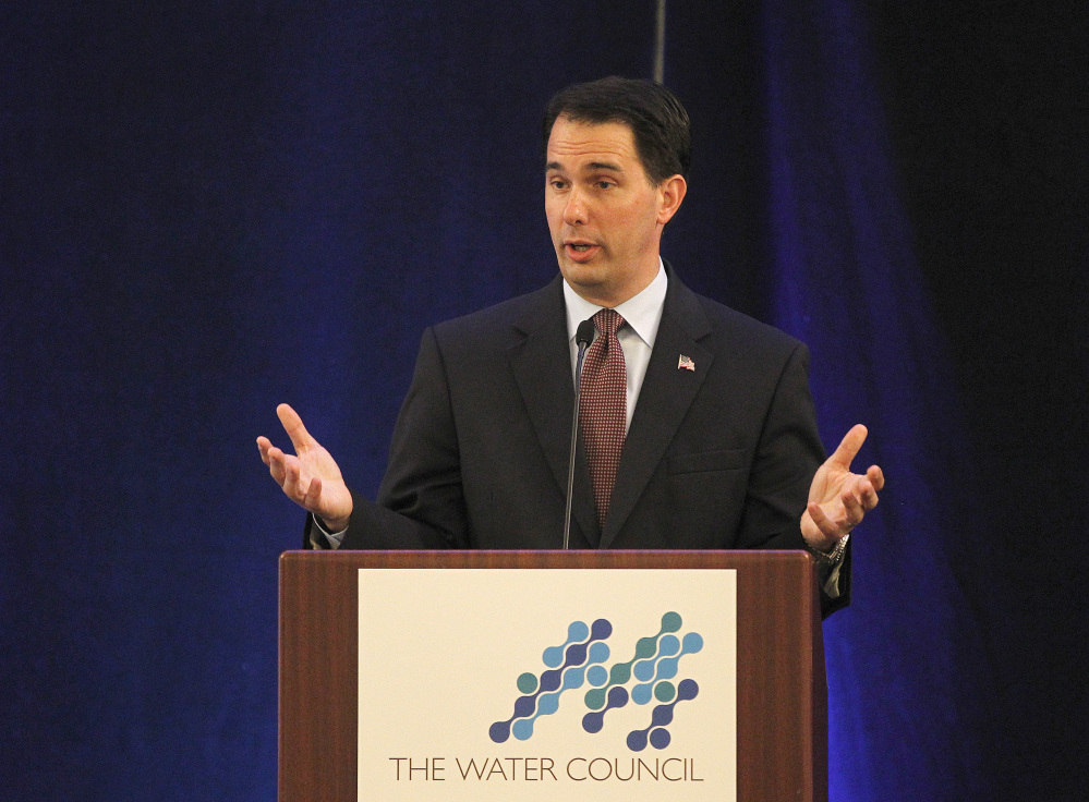 Wisconsin Gov. Scott Walker talks to a Water Council conference at the Hilton Milwaukee City Center on Thursday,  June 19, 2014.  Court documents released publicly for the first time Thursday offer new insight into prosecutors’ secret investigation of potential illegal campaign fundraising activities by Walker’s campaign. The 266 pages of unsealed documents show investigators viewed Walker as having a central role in the alleged scheme.