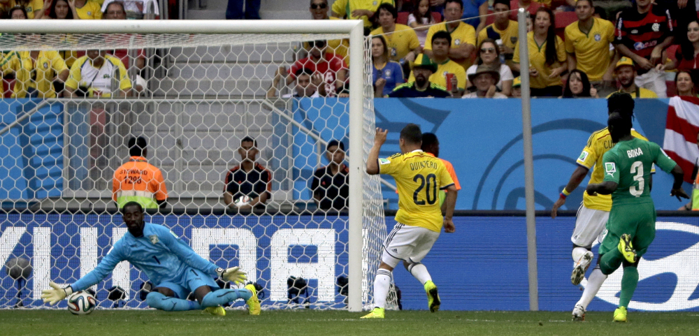 Colombia’s Juan Quintero (20) scores his side’s second goal during the group C World Cup soccer match.