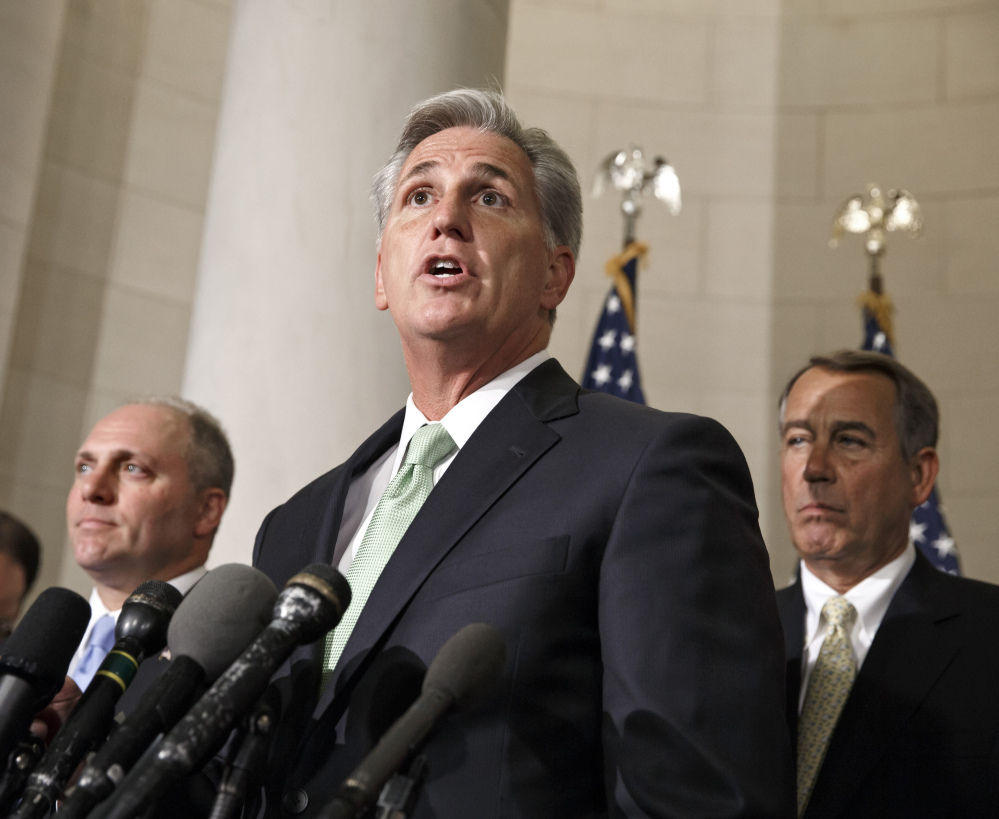 House Majority Whip Kevin McCarthy, R-Calif., is joined by Rep. Steve Scalise, R-La., left, and Speaker of the House John Boehner, R-Ohio, right, Thursday on Capitol Hill.