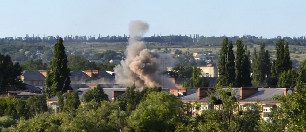 Smoke rises from an explosion near a children’s hospital following shelling from Ukrainian government forces in Slovyansk, Ukraine, on Thursday.