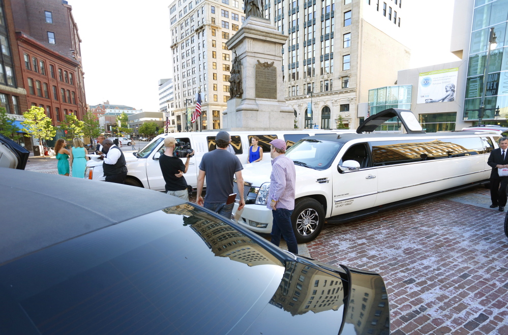 A reality TV show called “Passing the Buck” is filmed in Monument Square on Thursday.