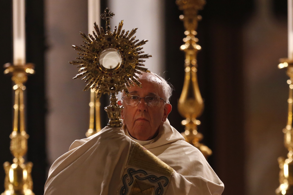 Pope Francis holds a monstrance containing a Holy Host at the end of the Corpus Domini procession from St. John at the Lateran Basilica to St. Mary Major Basilica to mark the feast of the Body and Blood of Christ, in Rome on Thursday.