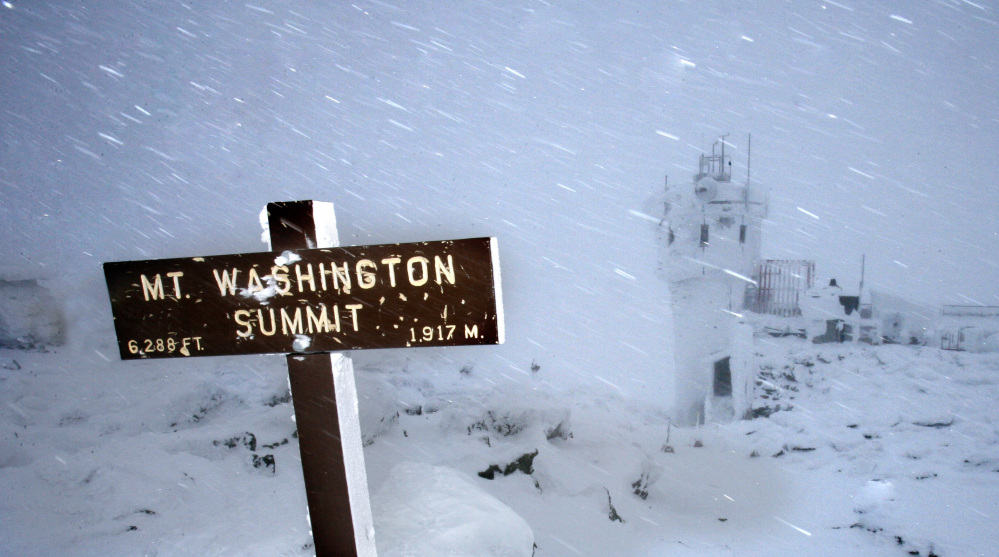 In this Feb. 1, 2007 file photo, wind and driving snow are seen on the top of the highest peak in the Northeast,  Mount Washington, in New Hampshire. Extreme Mount Washington sits on the top of the Northeast’s highest peak, in New Hampshire. The museum recently underwent a $1 million transformation from a modest collection of artifacts behind glass to a modern facility packed with hands-on exhibits.