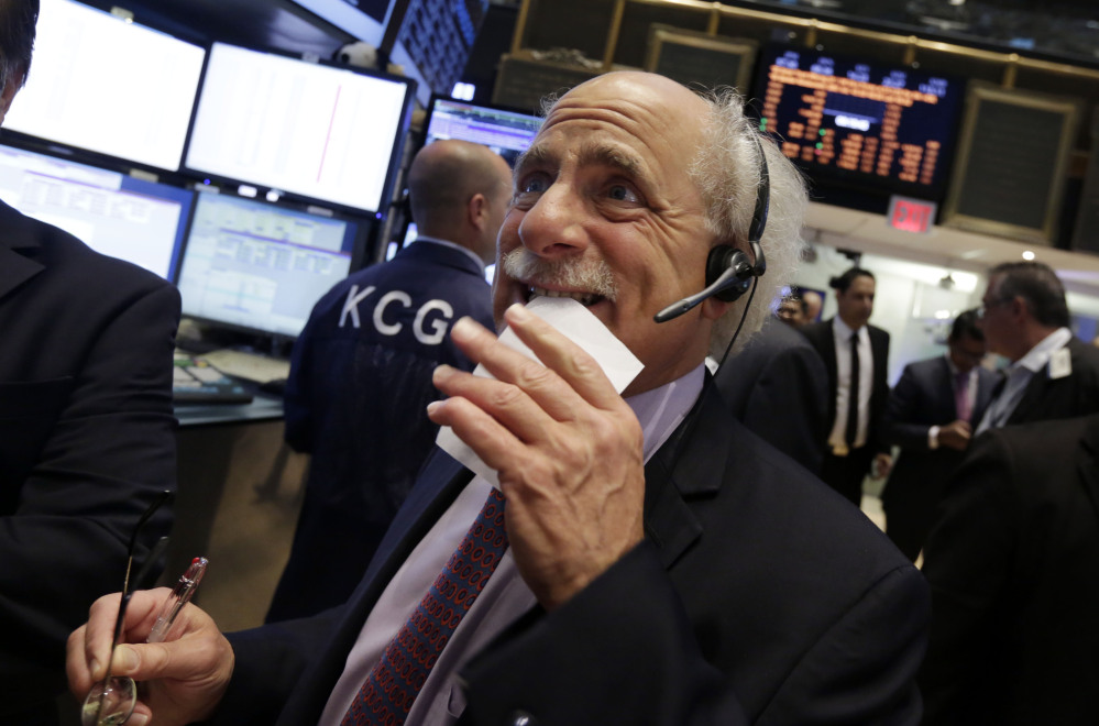 Trader Peter Tuchman works on the floor of the New York Stock Exchange on Friday.