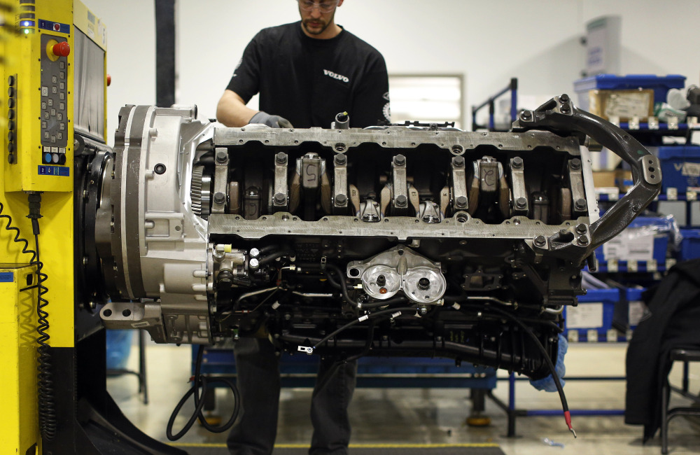 Jon Wyand works on a truck engine assembly line at Volvo Trucks’ powertrain manufacturing facility in Hagerstown, Md. Recent good news on manufacturing and hiring has boosted confidence in the economy. Manufacturing is expanding at a healthy pace and the service industry continues to grow.