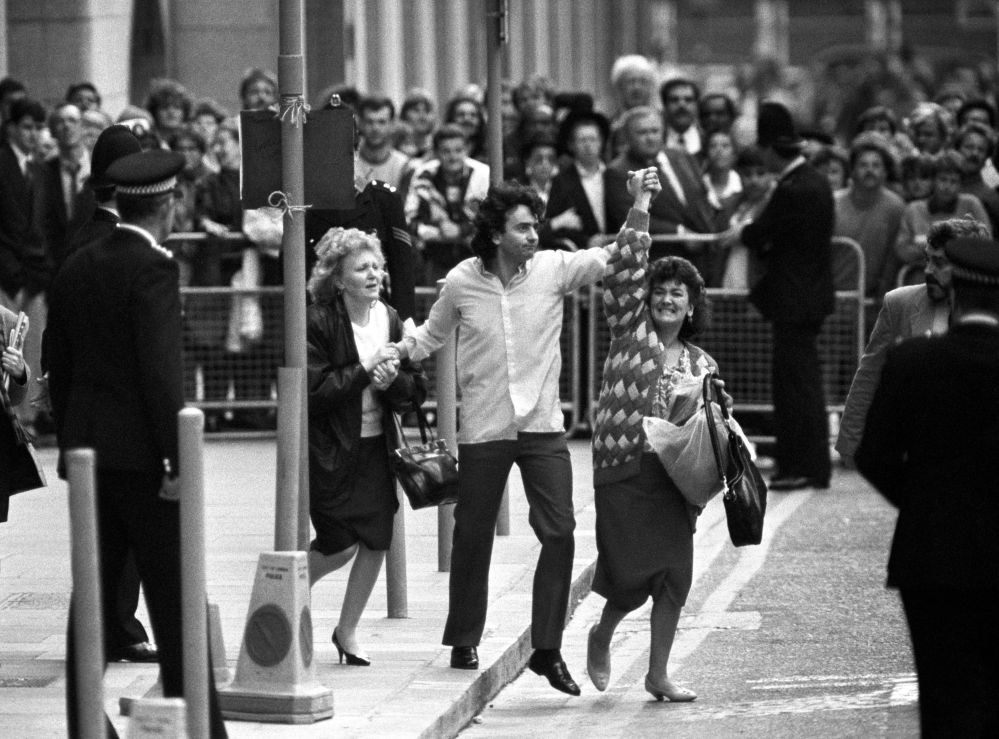In this 1989 file photo, Gerry Conlon, center, is seen outside the Old Bailey after being released for being wrongly convicted of the Guilford pub bombings, in London. His family says Gerry Conlon, who was imprisoned unjustly for an IRA bombing and inspired an Oscar-nominated film, has died at his Belfast home following a long battle with cancer. He was 60.