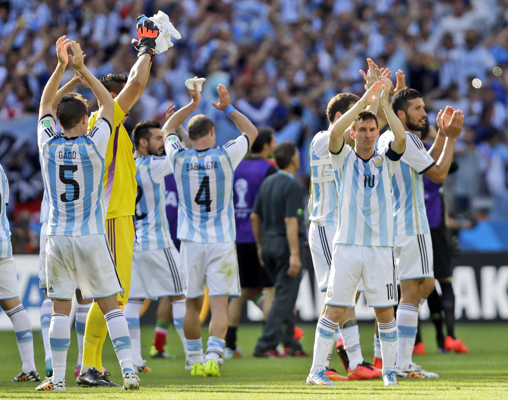 Argentina’s Lionel Messi and his teammates applaud after their 1-0 victory over Iran during the group F World Cup soccer match between Argentina and Iran at the Mineirao Stadium in Belo Horizonte, Brazil, on Saturday.