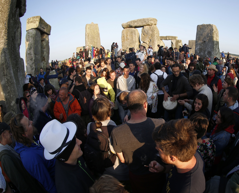 Thousands of revelers gather Saturday at Stonehenge near Salisbury, England, to celebrate the summer solstice.