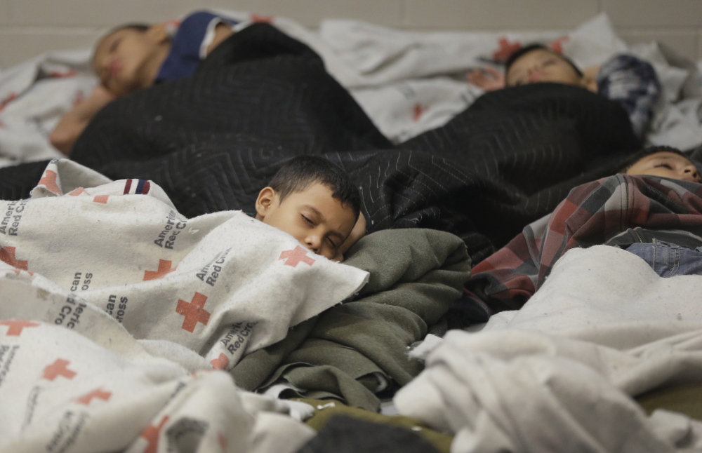Child detainees sleep in a holding cell at a U.S. Customs and Border Protection processing facility in Brownsville, Texas. Thousands of immigrant children are crossing alone into the United States.